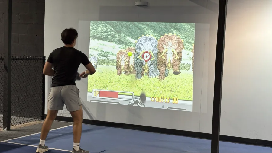 Camera-tracked interactive projection wall running live at a commercial venue
